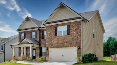 Craftsman house with an attached garage, brick siding, concrete driveway, and a shingled roof