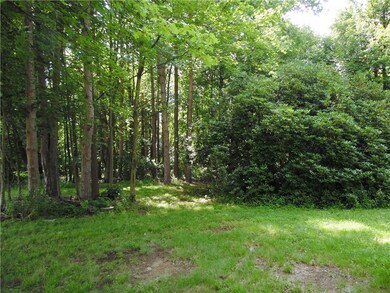 2.48 acres mostly wooded.