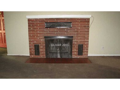 Living Room. Brick woodburning Fireplace