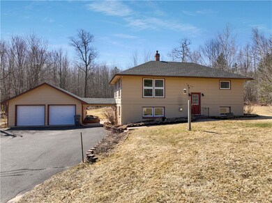 Large 2 car garage with overhang entrance to the h