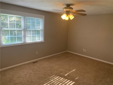 Spacious master bedroom with neutral colors