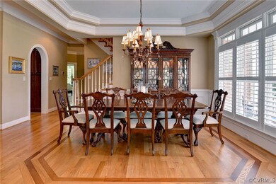 The trayed ceiling, and chandelier along with the wainscoting make this a perfect place to entertain. Big enough to set a buffet for the holidays.
