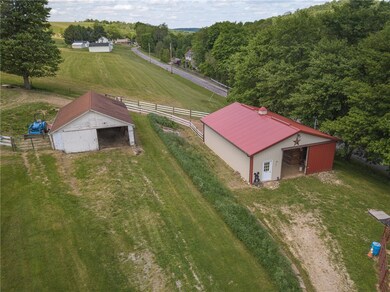 30'x36' barn, White barn is hay storage & equip.