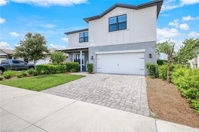 View of property with a garage