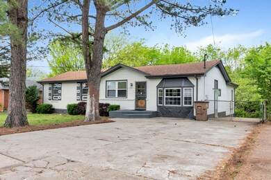 Double driveway that extends thru fence to the backyard