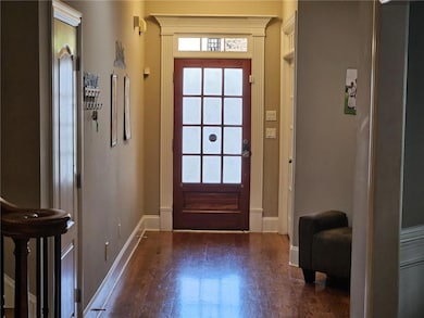 Foyer entrance with baseboards