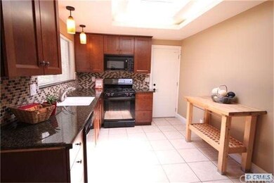 Remodeled kitchen with granite counters and newer 