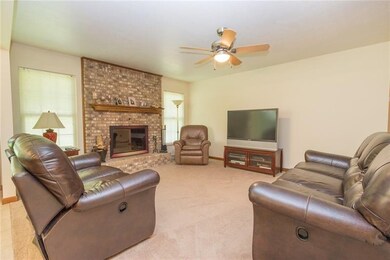 Spacious living room with wood burning fireplace a