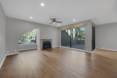 Spacious living room with large windows offering s