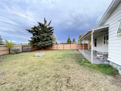 Fenced backyard with a patio area