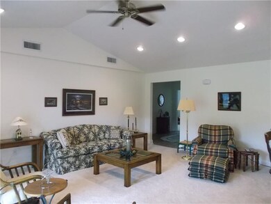 Large living area with vaulted ceiling.