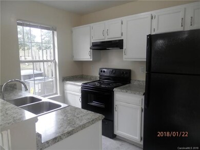 Bright Open Kitchen with Matching Appliances