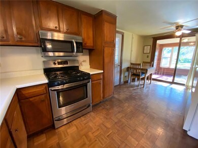 Kitchen with stainless stove and microwave