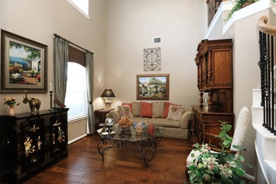This spacious home office area is to the left as you step inside. This flexible room is currently used by the homeowner as a formal living room.