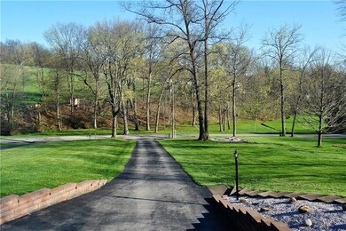 View from front porch. Big front yard and long dri