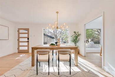 Dining space featuring baseboards, a notable chand