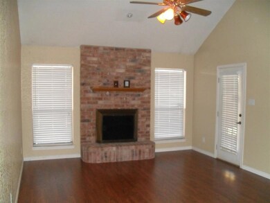 Unfurnished living room featuring baseboards, ceil