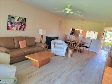 Living area featuring wood finish floors and a ceiling fan