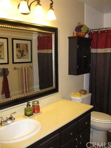 Hall bathroom with shower/tub combo.