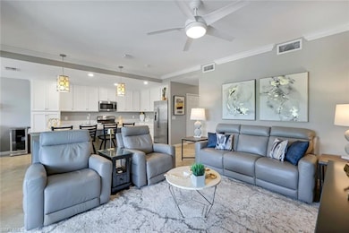 Great room featuring ornamental molding, and recessed lighting