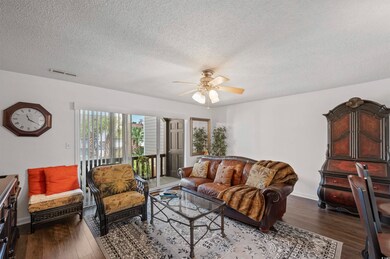 Living room featuring dark hardwood / wood-style f