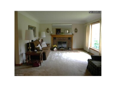 Great room with fireplace and hardwood floors unde