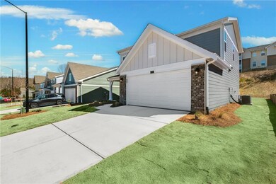 View of property exterior featuring brick siding, 