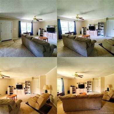 Spacious living room w ceiling fan.