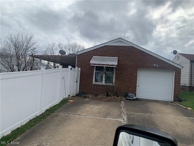 View of front facade featuring a garage