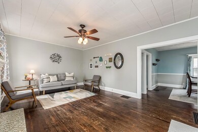 View 3 of living room into dining room.