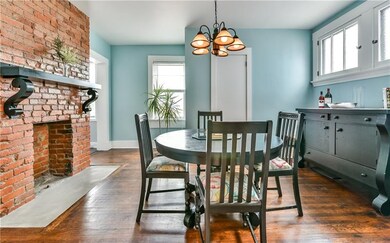 Nice sized dining room with brick decorative firep