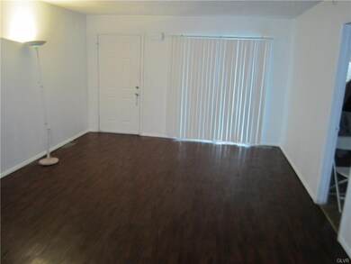 Living Room with sliding glass doors to front cove