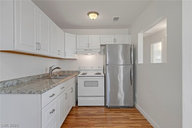 Kitchen with Refridgerator, Stove and Garbage Disp