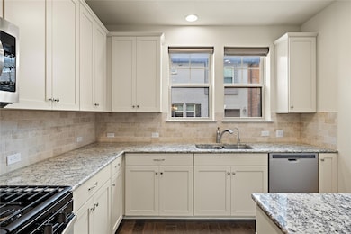 Kitchen with a sink, appliances with stainless st