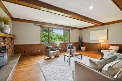 Charming sunken family room with pegged oak hardwood floors