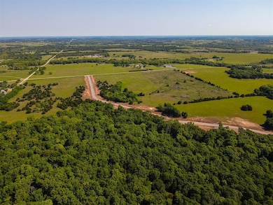 View of rural area featuring a heavily wooded area