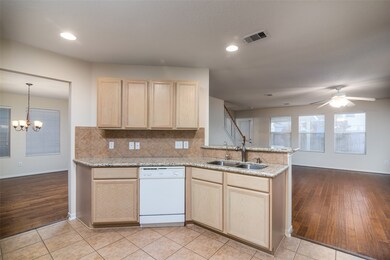 Kitchen with granite counter tops and large pantry.