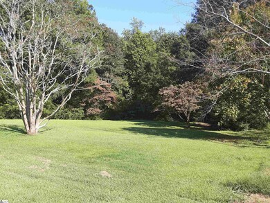 Lush green grass throughout the yard beckons you t