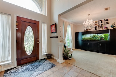 This photo showcases a welcoming entryway with a d