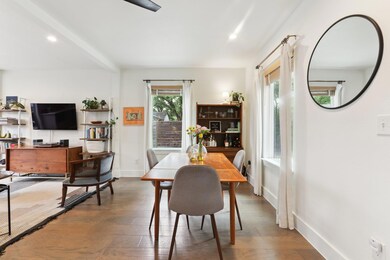 Dining space featuring baseboards, hardwood / woo