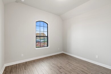 Your secondary bedroom features sleek floors, fres