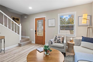 Living room with light wood-type flooring