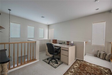 Loft area overlooks great room with soaring two st