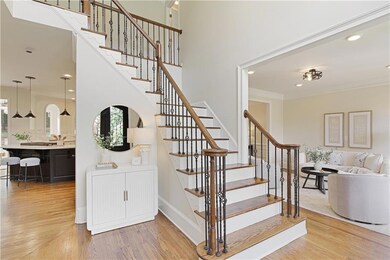 Stylish open stairwell connects the main and upper