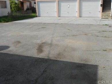 Another view of parking in front of garages and tu