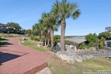 View of property's community featuring fence