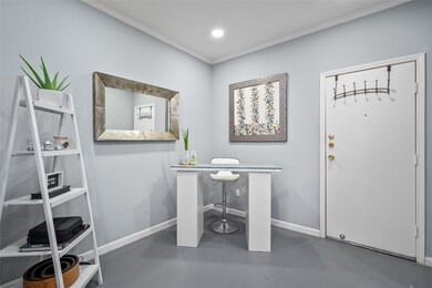 This inviting entryway doubles as a sleek and mode