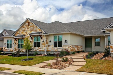 View of front of property with a front yard