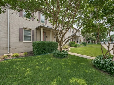 View of front of property featuring brick siding, a front yard, and crawl space