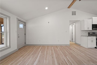 Living Room w/ vaulted ceiling